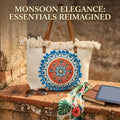 A large canvas tote bag featuring an embroidered geometric mandala circular design on the front panel with a fringed trim along the top rim and leather shoulder handles.