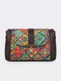 A textured crossbody sling bag featuring a vibrant multicolor front panel, shown open to display two top zipper sections and an adjustable shoulder strap.
