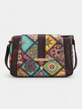 A textured crossbody sling bag featuring a vibrant multicolor front panel, shown open to display two top zipper sections and an adjustable shoulder strap.