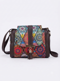A textured crossbody sling bag featuring a vibrant multicolor front panel, shown open to display two top zipper sections and an adjustable shoulder strap.