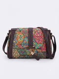 A textured crossbody sling bag featuring a vibrant multicolor front panel, shown open to display two top zipper sections and an adjustable shoulder strap.