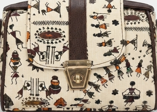 A textured crossbody sling bag featuring a vibrant multicolor front panel, shown open to display two top zipper sections and an adjustable shoulder strap.